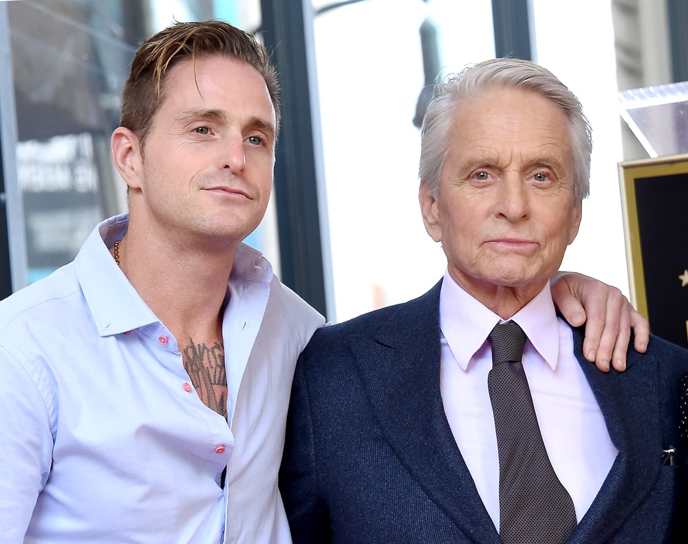 Michael Douglas claims Julia Roberts had his arm around his son, Cameron (left) at a Golden Globes party when he was 13 (Getty)