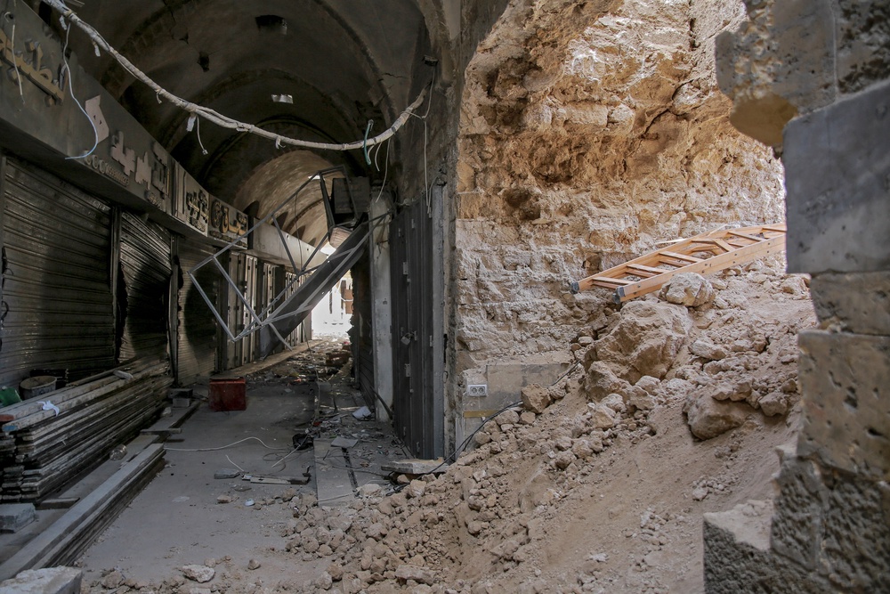 Rubble and collapsed arches mark the site of the historic Qaysariyya market following severe bombardment in the Old City (AFP/Getty)