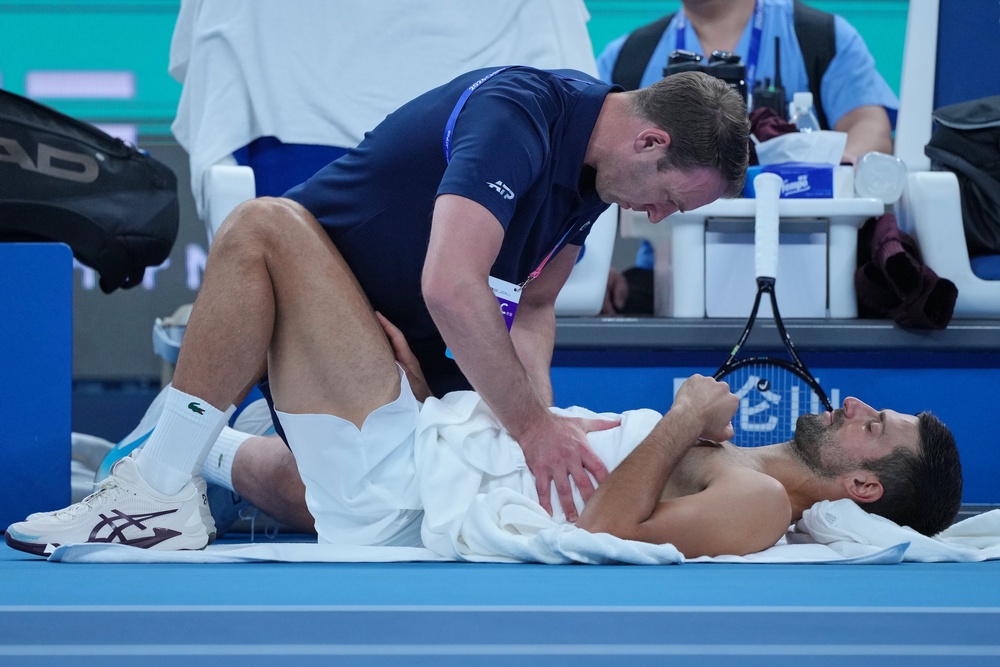 Novak Djokovic receives treatment (Achmad Ibrahim/AP) (AP)