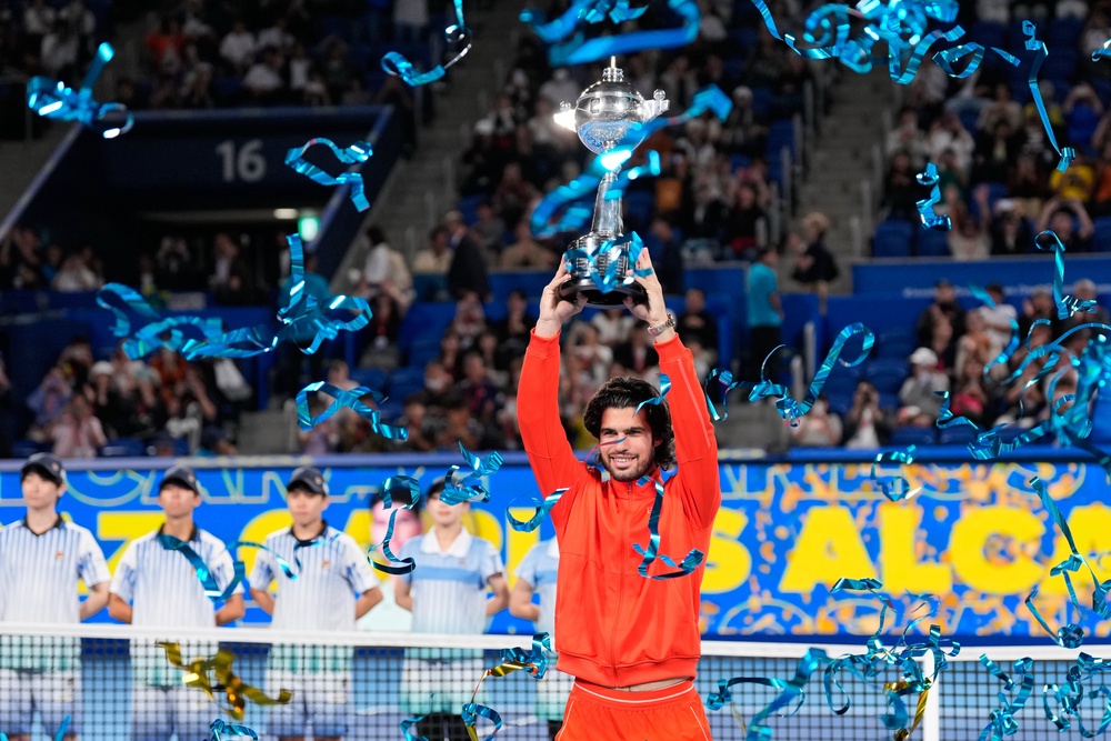 Carlos Alcaraz lifts the Japan Open trophy (Eugene Hoshiko/AP) (AP)