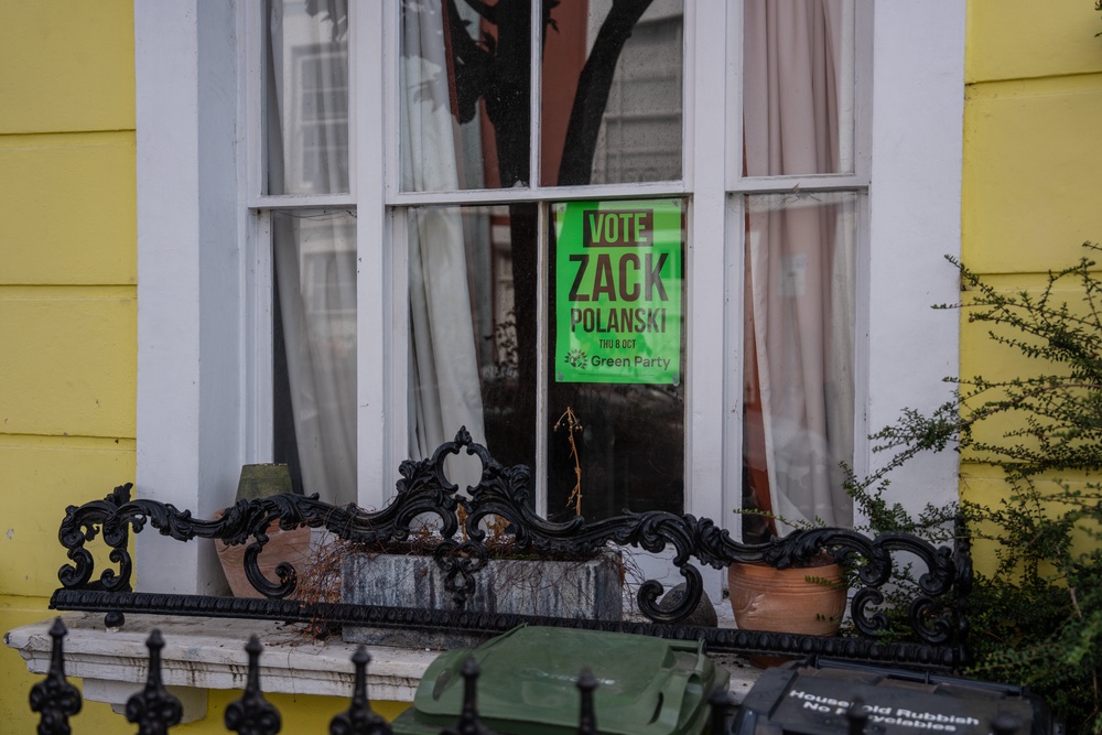 A Green Party flyer is displayed in a house window ahead of the Holborn and St Pancras by-election (Getty)