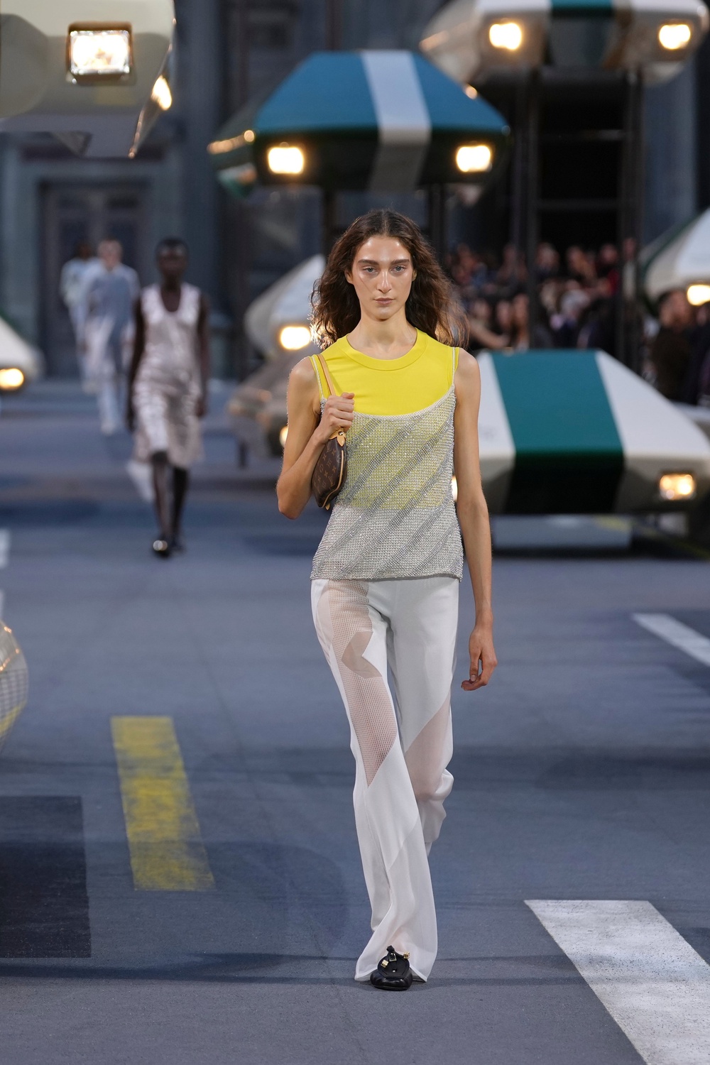 Scoop necklines and Noughties layering defined the opening looks on the runway (Aurelien Morissard/AP) (AP)