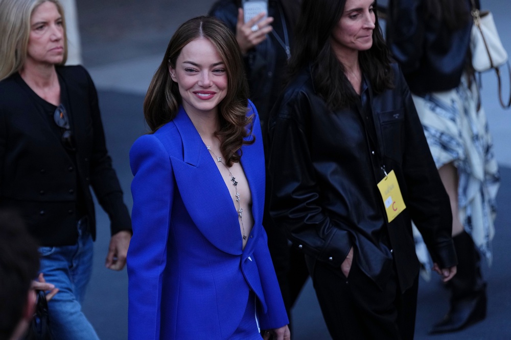 Emma Stone wore a plunging blazer and mini skirt (Aurelien Morissard/AP) (AP)