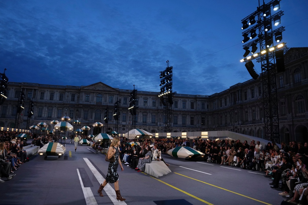 Floating cars were suspended above a racetrack-inspired runway (Aurelien Morissard/AP) (AP)