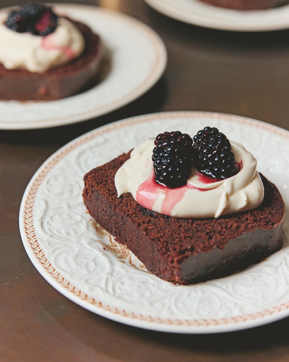 Guinness runs through Bhogal’s rich chocolate cake, finished with Irish cream, chocolate glaze and boozy blackberries (Matt Russell)
