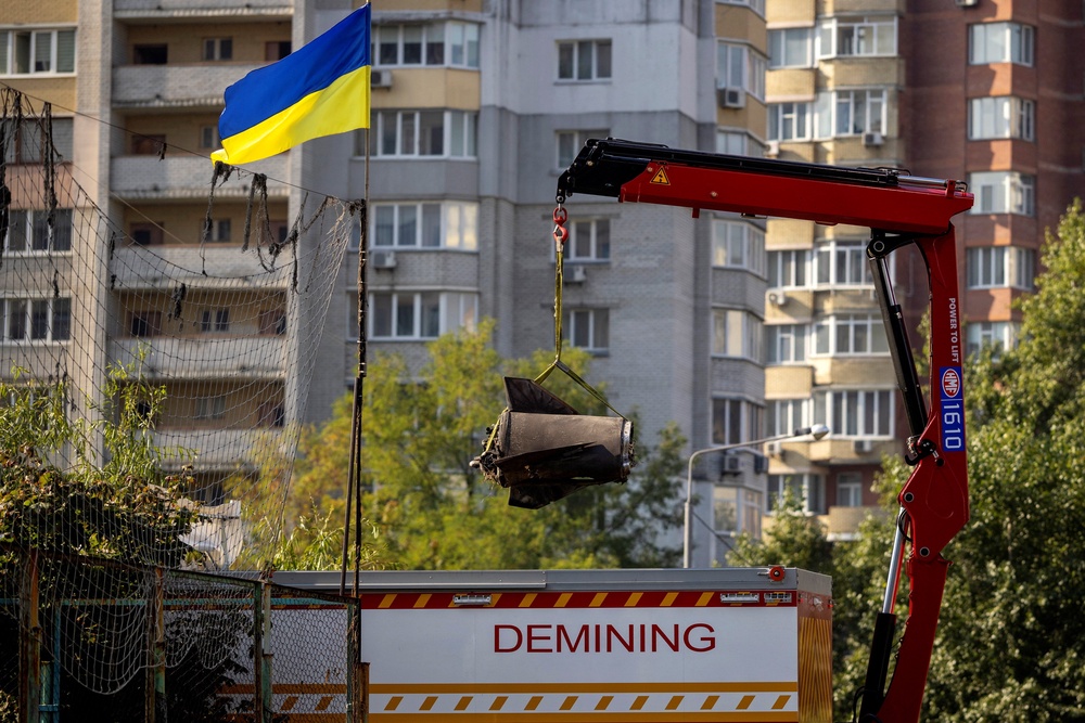EOD specialists remove the debris of a Russian missile that fell in a residential neighborhood during a night of Russian missile attacks (Reuters)
