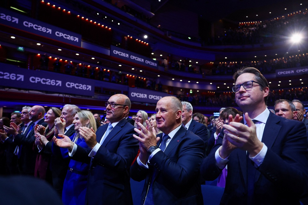 The Conservative Party conference applauds as Kemi Badenoch speaks (Reuters)
