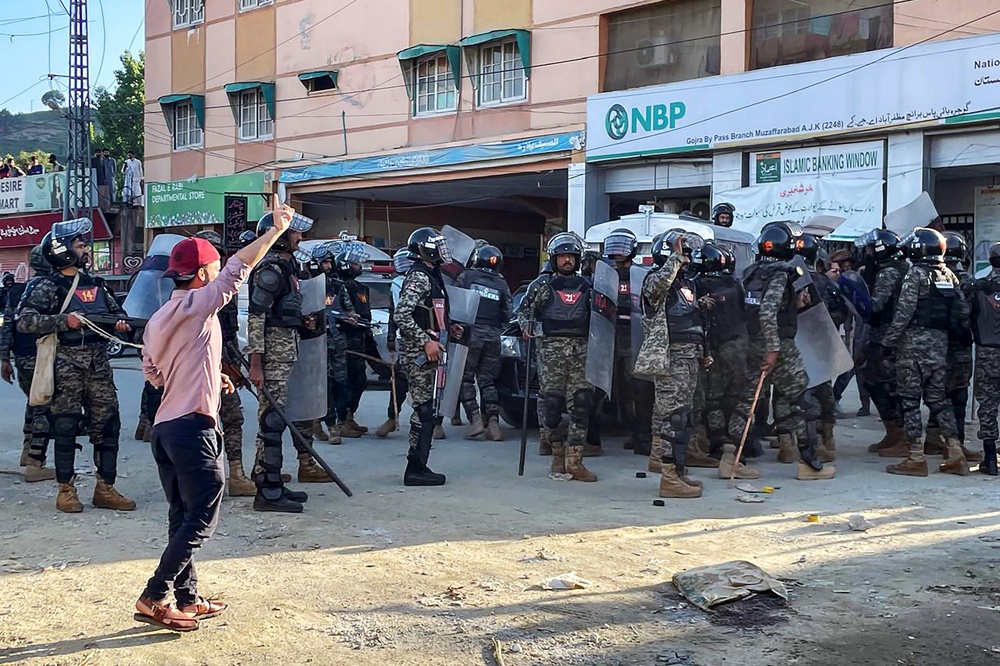 File: Pakistani rangers cordon off a street during a protest by Kashmiri demonstrators of Jammu Kashmir Joint Awami Action Committee (JAAC) to condemn the soaring electricity and flour prices (AFP/Getty)