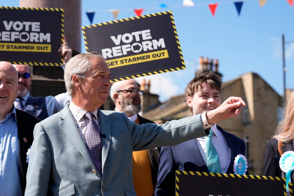 Nigel Farage during a visit to Denby Dale in Kirklees in April (PA)