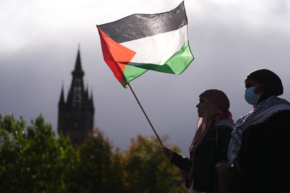 People take part in a pro-Palestine protest outside the University of Glasgow Library (Andrew Milligan/PA) (PA Wire)