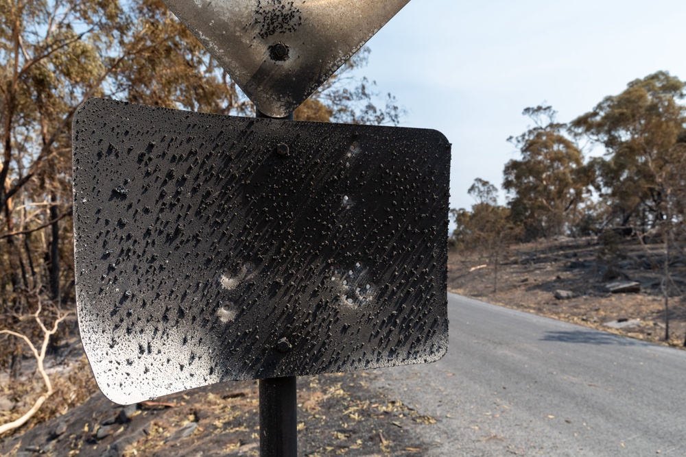 A charred road sign in Harcourt, Australia (Getty)