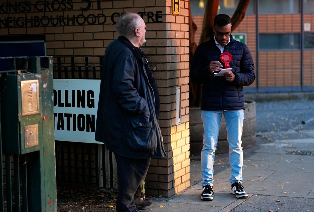 A voter at Kings Cross Brunswick Neighbourhood Association polling station, London, as voting gets underway in the Holborn and St Pancras by-election, (PA)