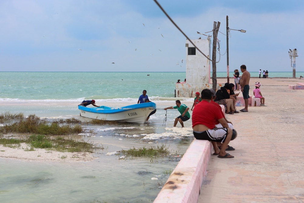 Fishermen secure their boats as Tropical Storm Isaias moves through the Gulf of Mexico (Reuters)