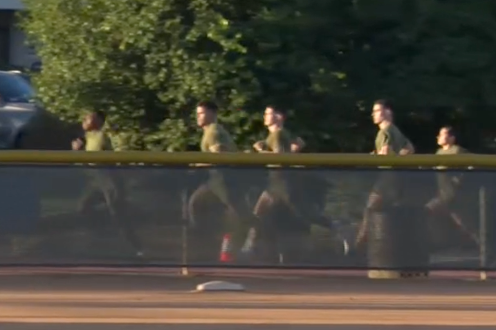 At one point, a group of service members could be seen running with Hegseth lagging behind. He is out of frame in this image (C-Span)