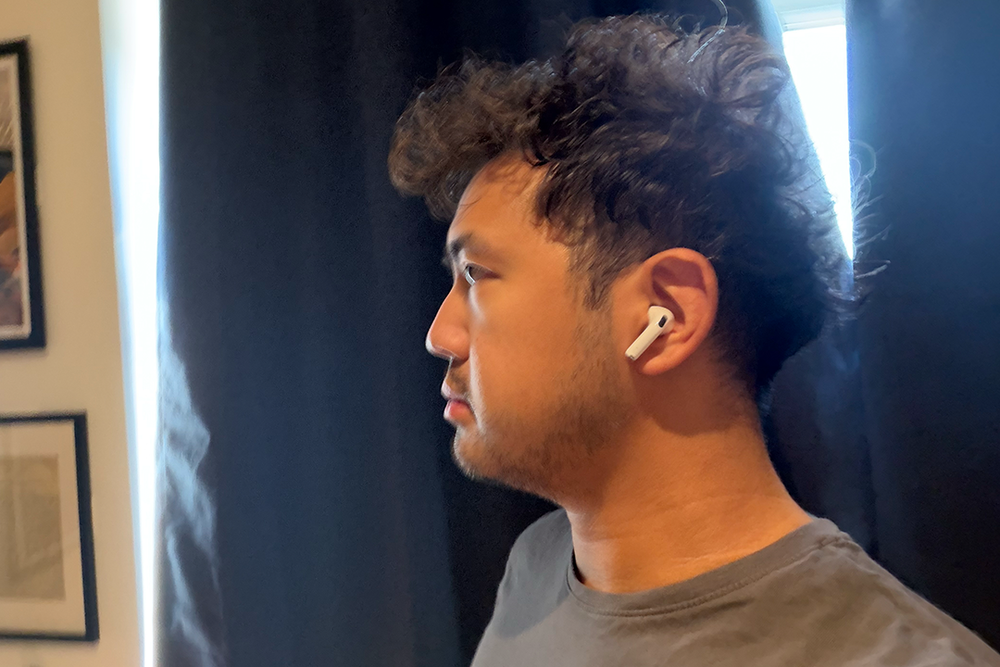 The AirPods 5 just sit in your ear, rather than plugging it (Alex Lee/The Independent)