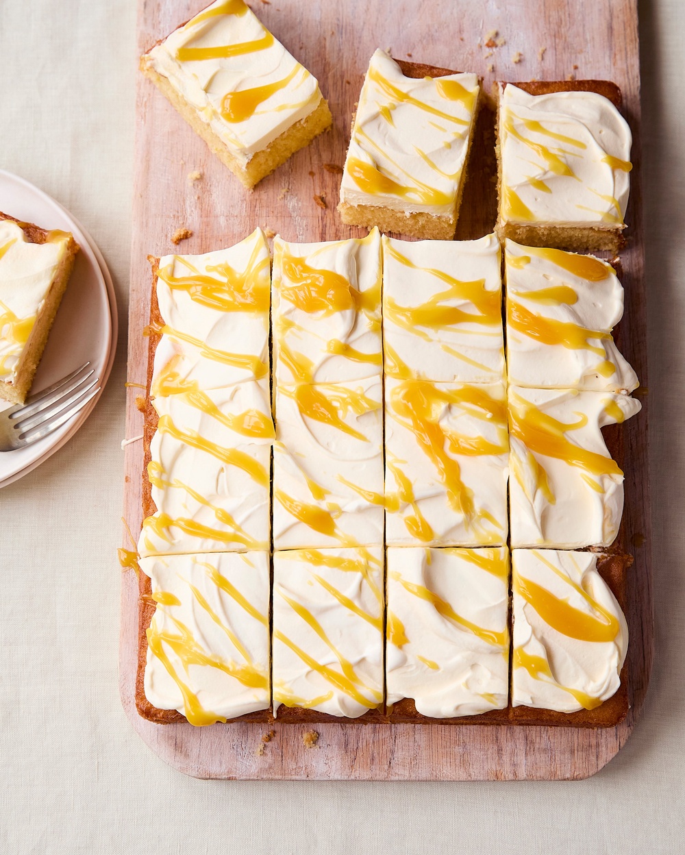 A light lemon sponge topped with passion fruit cream makes this easy traybake perfect for sharing (Tara Fisher)