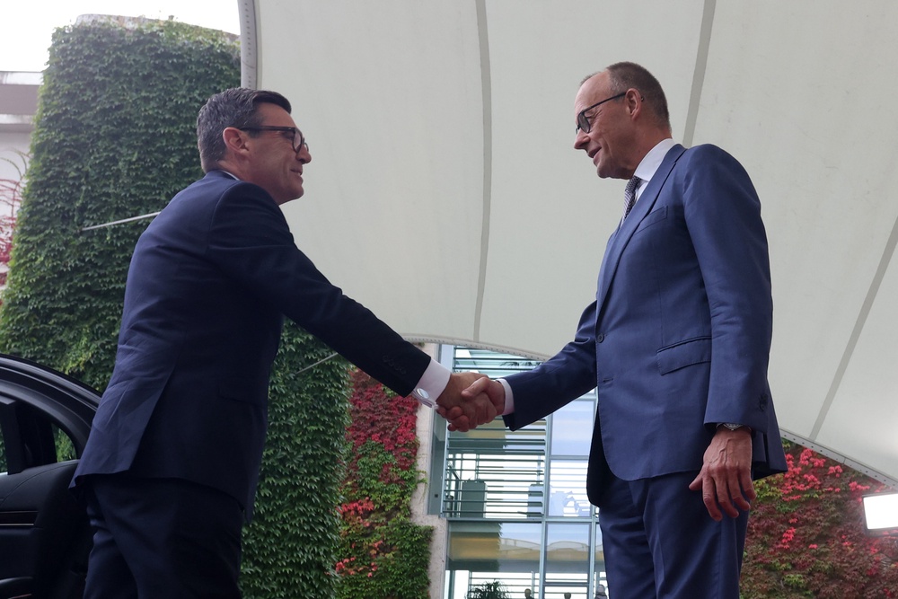 German Chancellor Friedrich Merz (R) welcomes British Prime Minister Andy Burnham (Getty)