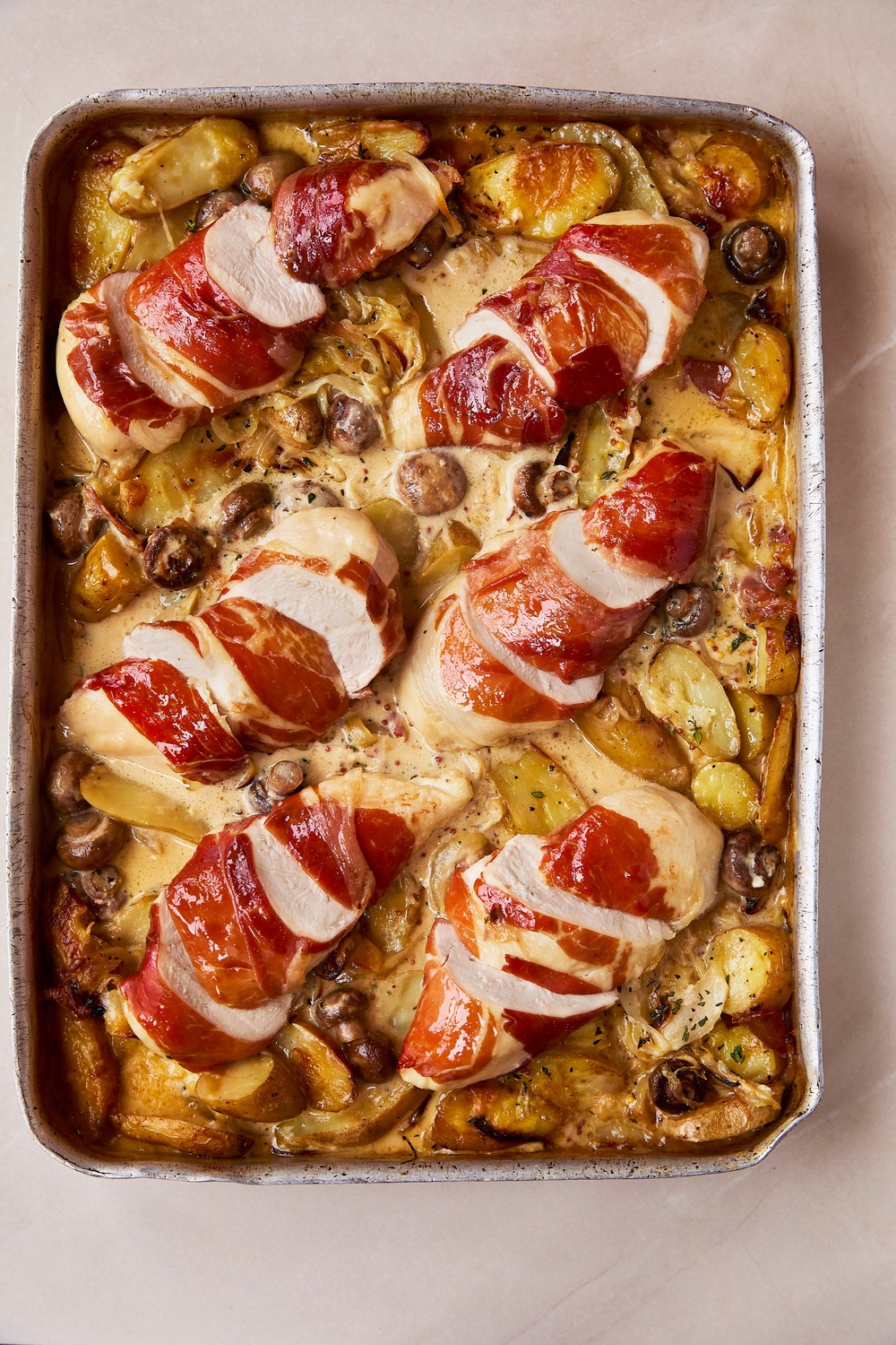 Berry’s rich chicken tartiflette brings together ham-wrapped chicken, potatoes, mushrooms and melted Reblochon cheese (Tara Fisher)