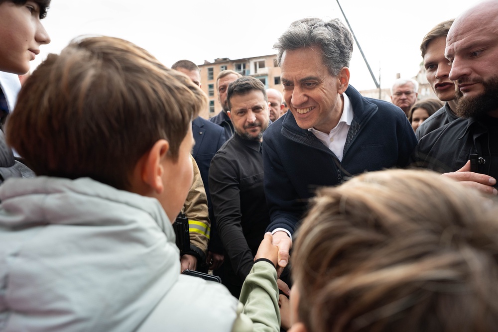 Mr Miliband meet local residents during his visit to Pryluky (Stefan Rousseau/PA) (PA Wire)