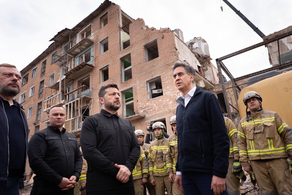Mr Miliband joined Ukrainian President Volodymyr Zelensky to see the aftermath of the attack (PA Wire)