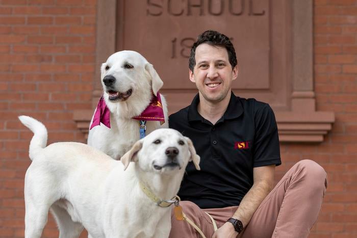 Noah Snyder-Mackler with his two dogs Homer, center, and Juno (Deanna Dent, Arizona State University)