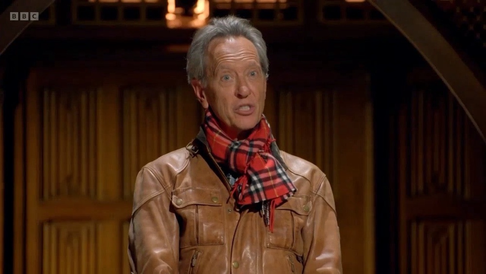 Richard E Grant made history after he became the first Traitor to be banished after the first roundtable (Celebrity Traitors/BBC)