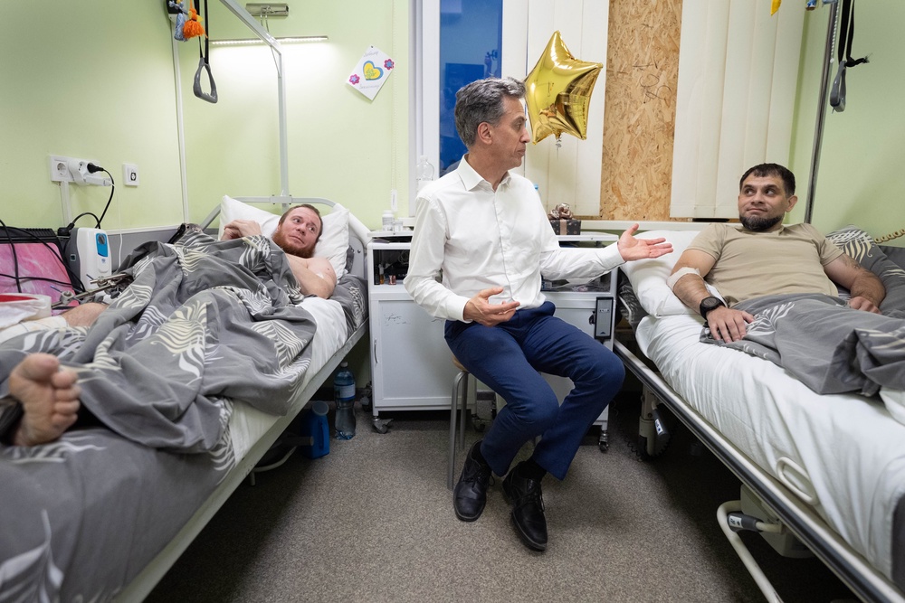 Foreign secretary Ed Miliband meets wounded Ukrainian security personnel at the Main National Hospital of the Interior Ministry in Kyiv (PA)