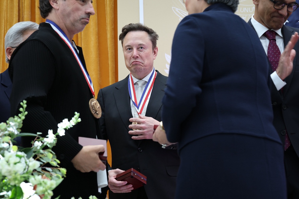 Co-founder of Google and former President of Alphabet Sergey Brin, U.S. President Donald Trump and Nvidia CEO Jensen Huang point to guests in the crowd during the Golden Age of American Innovation Summit at the Institute of Peace on October 08, 2026 in Washington, DC (Getty)