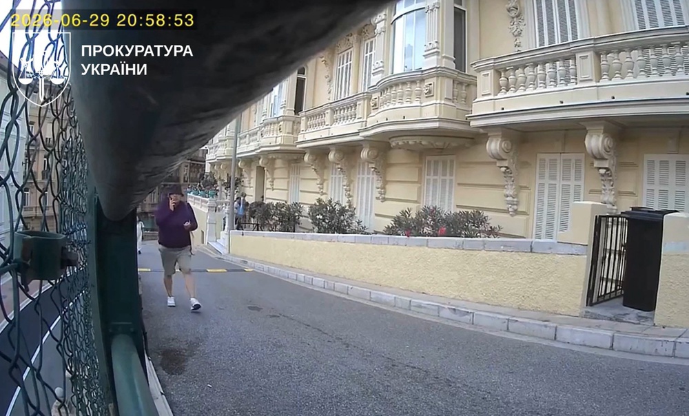 CCTV footage shows a person walking past a luxury apartment complex, moments before the parcel bomb attack in Monaco that wounded Ukrainian-born businessman Vadym Yermolaiev, his partner and teenage son. (AFP/Getty)