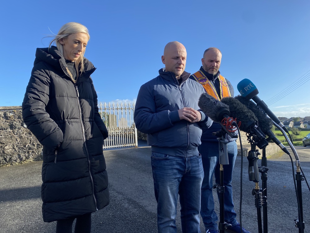 DUP MP Carla Lockhart, loyalist activist Jamie Bryson and Portadown Orange Order deputy district master Alastair Power speaking to the media at Drumcree Church on Friday (Jonathan McCambridge/PA) (PA Wire)