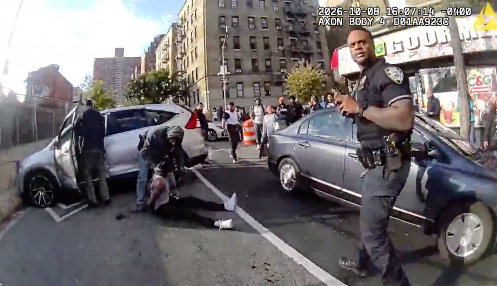 In this image taken from police-worn body camera video released the New York City Police Department (NYPD), law enforcement personnel tend to a Oscar Belgal, 28, a Dominican man who was shot by Federal immigration officers, Thursday, Oct. 8, 2026, in New York, as he drove his car with a 5-year-old boy inside. (AP)