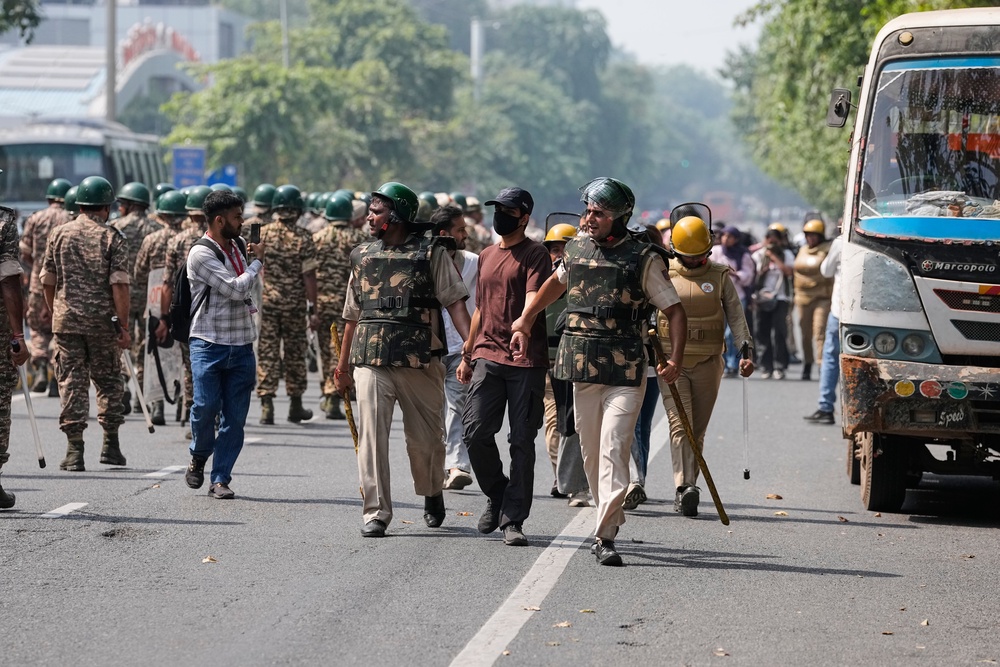 Police detain protesters in Delhi on 10 October 2026 (AP)