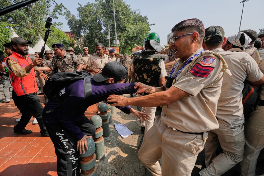 Police detain protesters in Delhi on 10 October 2026 (AP)