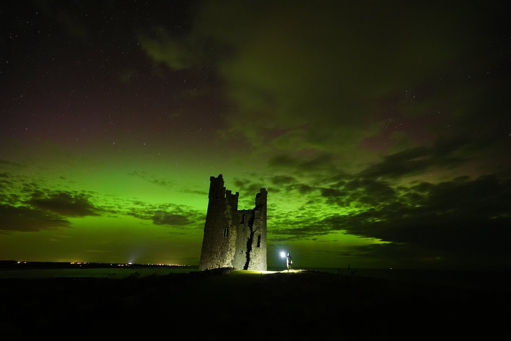 The sky was lit green and pink by the aurora borealis (Owen Humphreys/PA) (PA Wire)