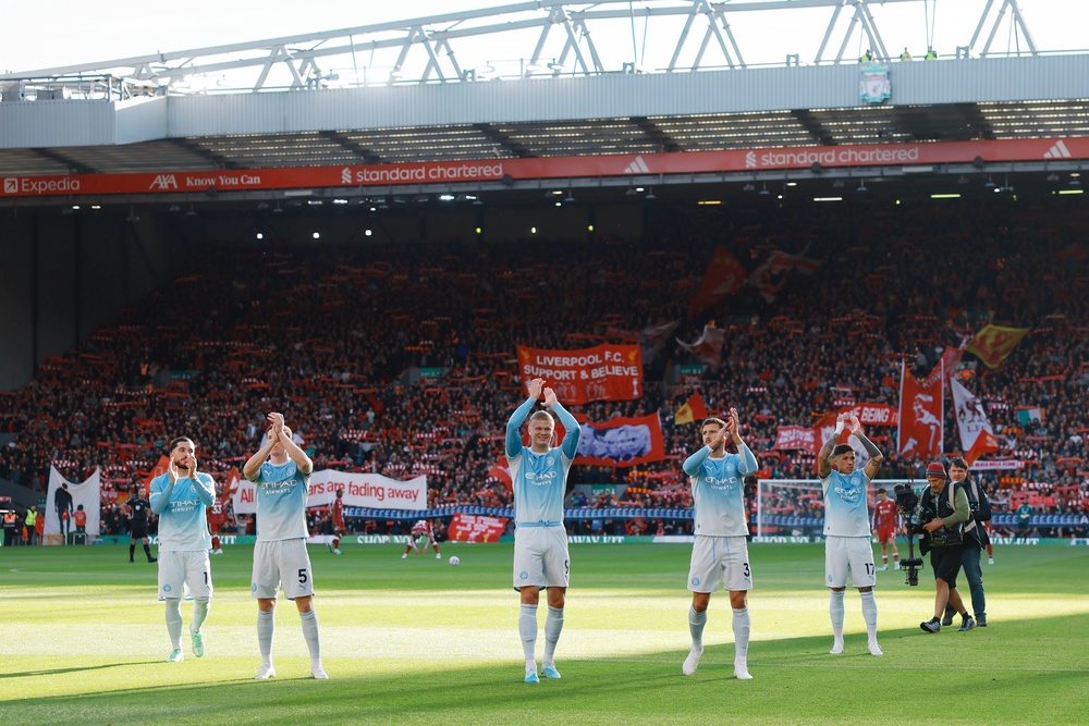 Manchester City celebrated their win at Anfield under the shadow of the independent commission's guilty verdict (Getty)