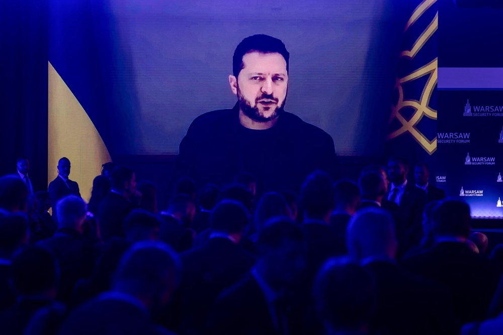 Participants listen as Ukraine's President Volodymyr Zelensky speaks via videolink during the opening session of the Warsaw Security Forum in Warsaw, Poland on October 12, 2026 (AFP/Getty)