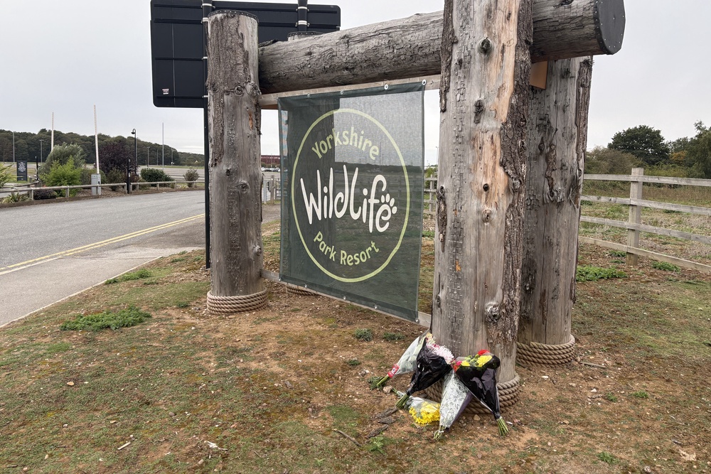Flowers left at the entrance of Yorkshire Wildlife Park in Doncaster, where a man died after suffering serious injuries in a tiger enclosure at the wildlife park (Dave Higgens/PA) (PA Wire)