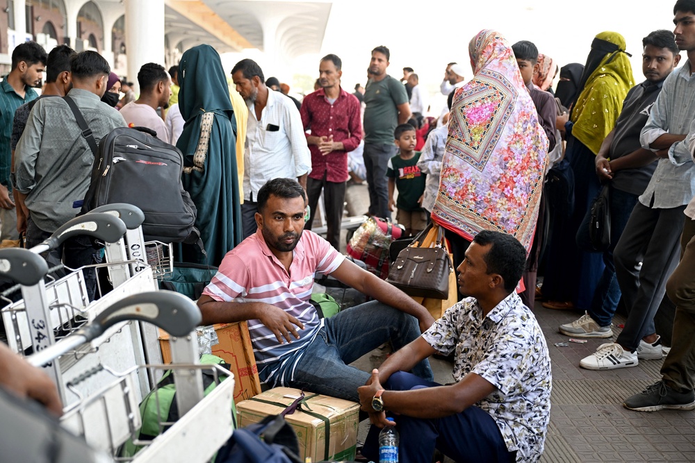 Saudi Arabia-bound passengers remain stranded at Hazrat Shahjalal airport in Dhaka on 12 October 2026 after their flights were cancelled a day after a Houthi strike at Riyadh airport (AFP/Getty)
