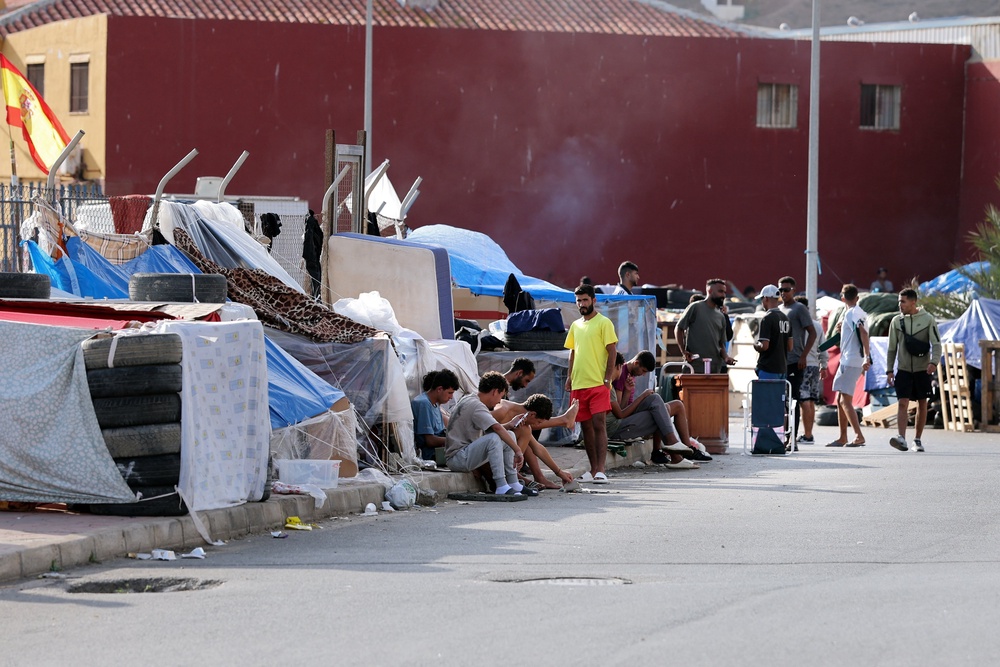Migrants wait in a makeshift camp near the Spanish-Moroccan border in Spain's North African enclave of Ceuta. (AFP/Getty)
