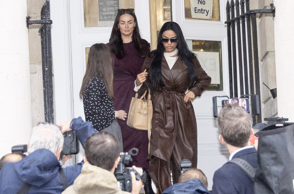 Katie Price (right) leaves after giving evidence at Lewes Crown Court (Jim Bennett/PA)