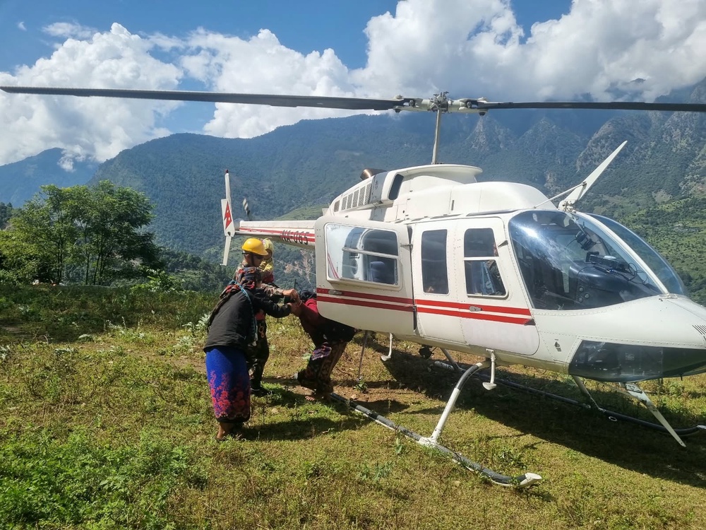 Residents affected by the flooding in Budhi Gandaki river are airlifted to safety (AP)
