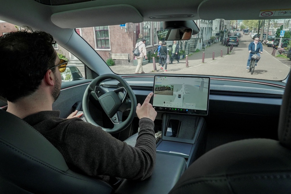 Tesla now has a hands-free car, but will self-driving cars make car sickness better or worse? (Reuters)
