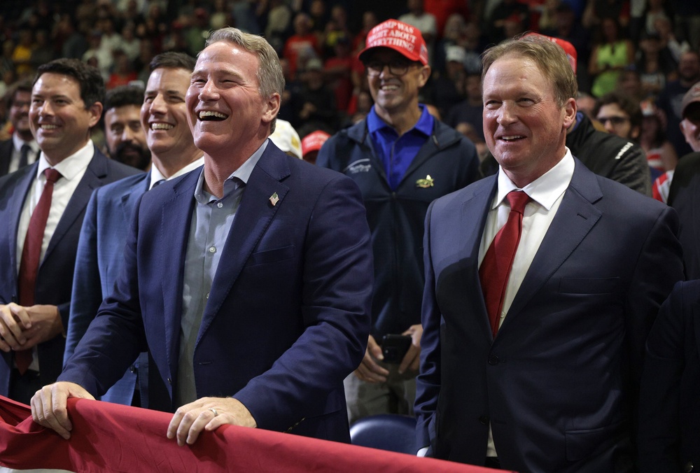 Jon Gruden, a former NFL and Super Bowl-winning coach, introduced the president at Monday’s rally and mentioned to Trump that he and Husted played together in college (Getty Images)