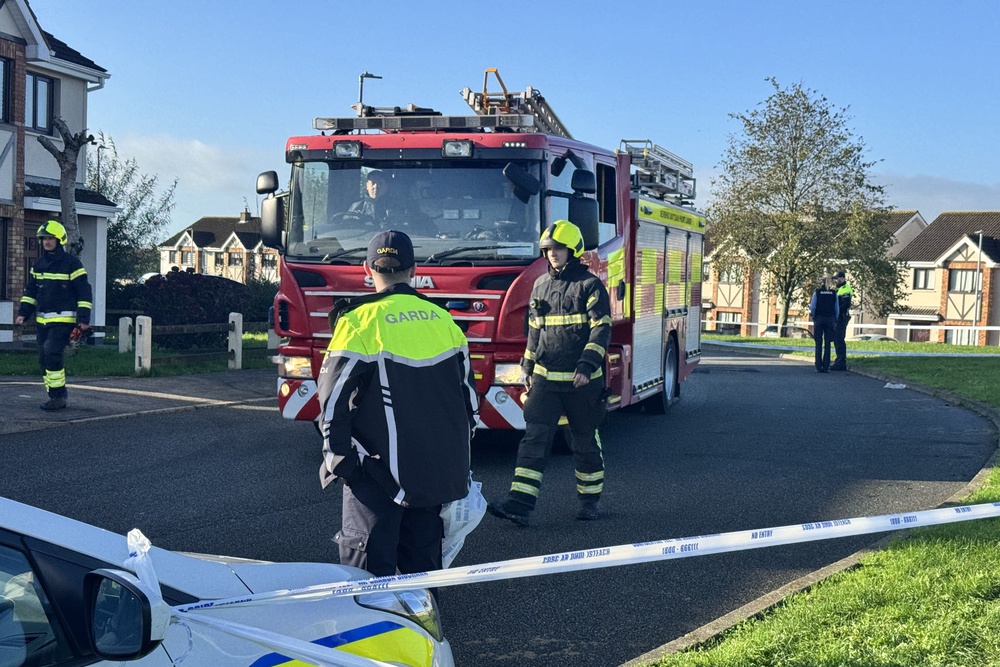 Emergency services at the scene of an overnight fire in the Birchwood estate in Waterford City. (PA Wire)