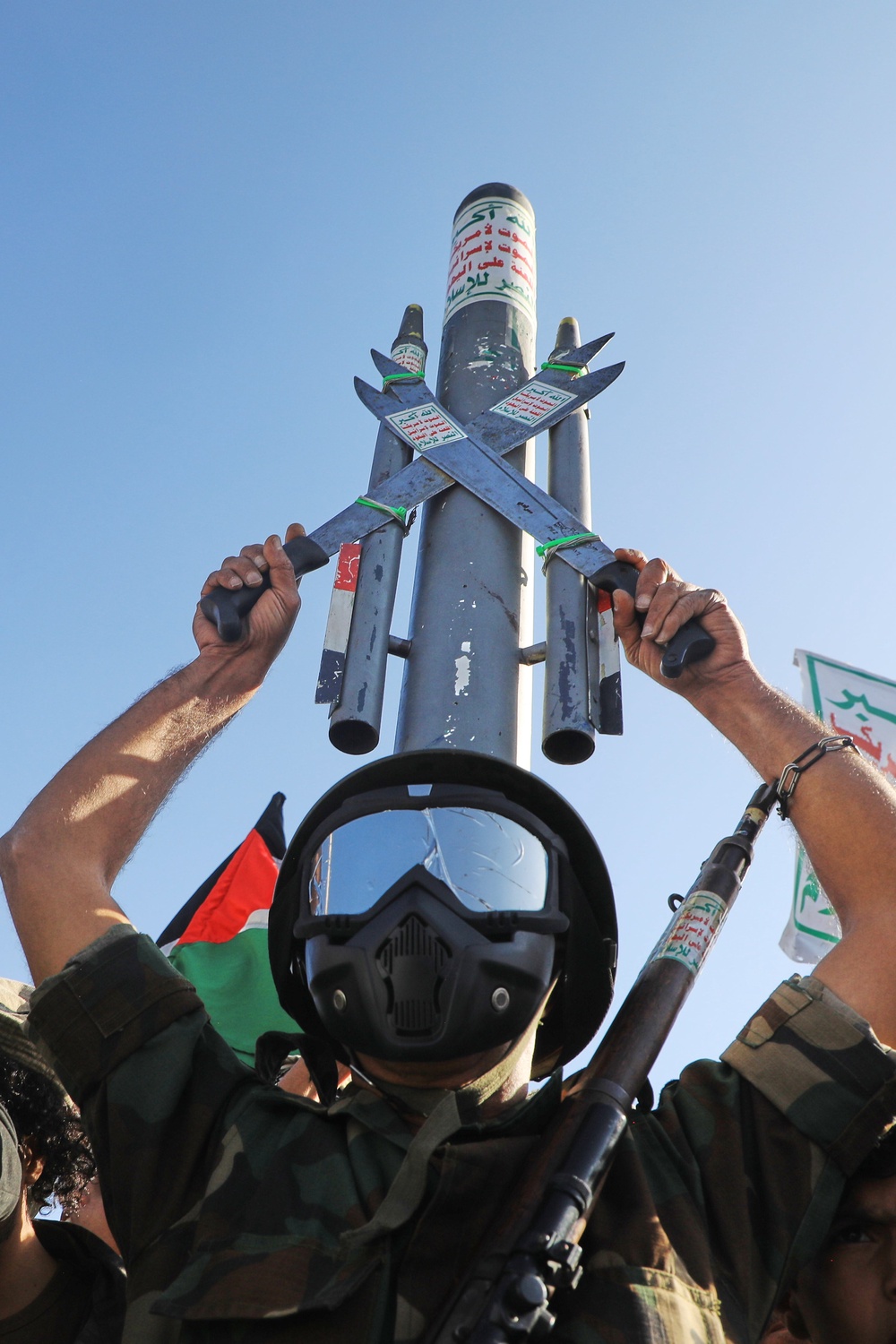 A Houthi supporter wearing a military uniform holds a mock missile during a rally in support of the group, in Sanaa, Yemen (Copyright 2026 The Associated Press. All rights reserved)