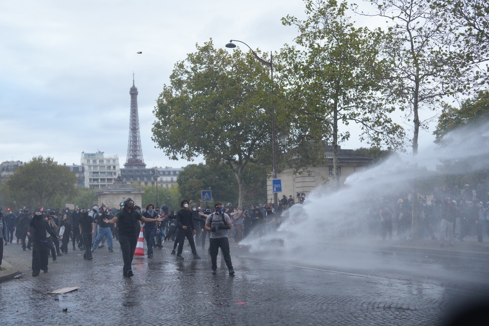 Police use water cannon after a march to protest against under-resourced schools in Paris (AP)