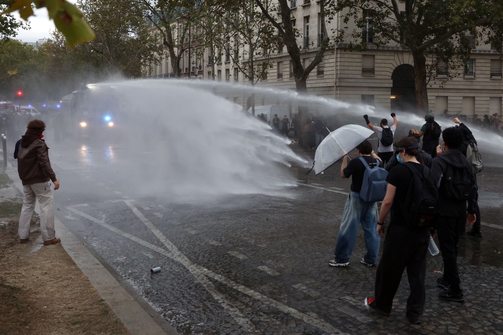 Riot police use water cannons during demonstrations (Getty)