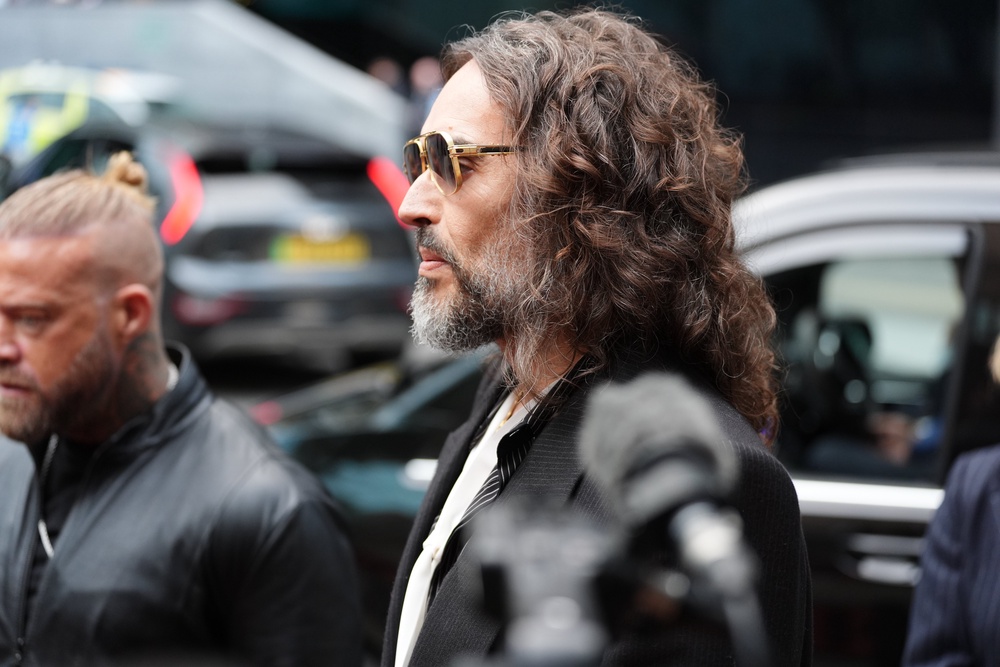 Russell Brand speaks to the media as he arrives at Southwark Crown Court (Ben Whitley/PA) (PA Wire)