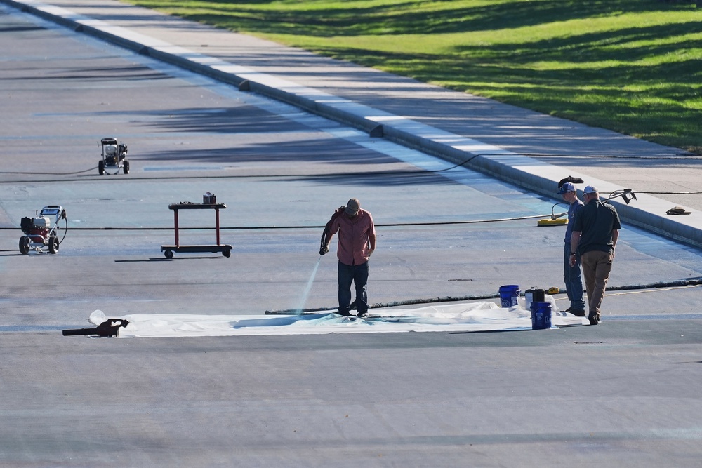 Workers have been forced to drain the pool and re-do renovations after administration officials admitted that damage to the monument was due to ‘botched’ construction, not vandalism, despite the president’s claims (AP)