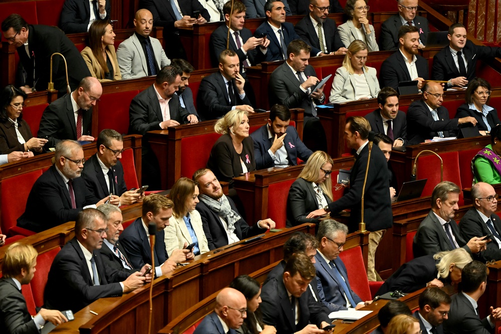 French far-right party Rassemblement National (RN) and allied party UDR's members of parliament, with group president Marine Le Pen sitting in the middle (AFP/Getty)